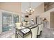 Open concept living and dining area with a fireplace, tall ceilings, and modern decor at 42 Renwick Ct, Raleigh, NC 27615
