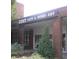 Exterior of Zest Cafe & Home Art showing brick facade and attractive landscaping at 42 Renwick Ct, Raleigh, NC 27615