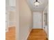 Inviting foyer with hardwood flooring, a hanging light fixture, and neutral wall paint at 42 Renwick Ct, Raleigh, NC 27615