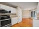 Efficient kitchen featuring stainless steel appliances and wood flooring at 42 Renwick Ct, Raleigh, NC 27615