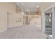 Spacious living area with an open floor plan, featuring tall ceilings and a view of the staircase at 42 Renwick Ct, Raleigh, NC 27615