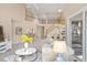 Spacious living room with an open floor plan, staircase, and view of the dining area at 42 Renwick Ct, Raleigh, NC 27615