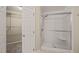 Bathroom showcasing glass-enclosed shower with built-in seat, and a large walk-in closet at 42 Renwick Ct, Raleigh, NC 27615