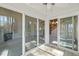 Bright sunroom featuring large sliding glass doors leading to the interior of the home at 42 Renwick Ct, Raleigh, NC 27615