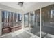 Bright sunroom featuring large sliding glass doors to a deck with wooded views, offering a seamless indoor-outdoor living experience at 42 Renwick Ct, Raleigh, NC 27615