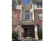 Welcoming entrance to a residential building featuring a well-lit doorway and a modern glass door with large window above at 421 Glencrest Pl, Chapel Hill, NC 27514