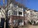 Inviting condo building with brick facade and charming balconies, offering a blend of classic and modern design elements at 421 Glencrest Pl, Chapel Hill, NC 27514