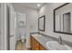 Bathroom featuring double sinks and granite countertops, with a separate toilet and shower at 4622 Vendue Range Dr, Raleigh, NC 27604