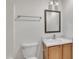Bathroom sink, mirror, lighting and toilet with wood vanity, ready for your design at 4622 Vendue Range Dr, Raleigh, NC 27604