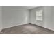 Neutral bedroom with carpet flooring and a bright window at 4622 Vendue Range Dr, Raleigh, NC 27604