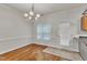 Cozy dining area with hardwood floors, natural light, and a smooth transition into the kitchen, creating a warm atmosphere at 4622 Vendue Range Dr, Raleigh, NC 27604