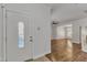 Bright foyer with decorative glass front door and hardwood floors at 4622 Vendue Range Dr, Raleigh, NC 27604