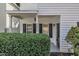 Inviting covered front porch with address number and black front door at 4622 Vendue Range Dr, Raleigh, NC 27604