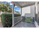 Open-air front porch with white railing, offering a glimpse of the surrounding neighborhood at 4622 Vendue Range Dr, Raleigh, NC 27604