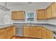 Beautiful kitchen featuring a stainless steel dishwasher, light wood cabinets, and modern countertops for a gourmet experience at 4622 Vendue Range Dr, Raleigh, NC 27604
