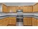 Updated kitchen with stainless steel appliances, light wood cabinets, and modern countertops for a functional cooking space at 4622 Vendue Range Dr, Raleigh, NC 27604