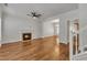 Spacious living room featuring hardwood floors, a fireplace, and a ceiling fan at 4622 Vendue Range Dr, Raleigh, NC 27604