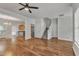 Bright living room with hardwood floors, connecting to kitchen and staircase at 4622 Vendue Range Dr, Raleigh, NC 27604