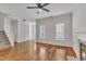 Bright living room features hardwood floors, two windows and a fireplace creating a cozy and inviting atmosphere at 4622 Vendue Range Dr, Raleigh, NC 27604
