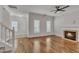 Inviting living room featuring a fireplace, hardwood floors, and an open layout at 4622 Vendue Range Dr, Raleigh, NC 27604