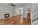 Cozy living room features a fireplace, hardwood flooring, and an open floor plan at 4622 Vendue Range Dr, Raleigh, NC 27604