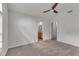 Main bedroom features a ceiling fan and adjoining ensuite bathroom at 4622 Vendue Range Dr, Raleigh, NC 27604