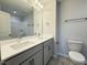 Modern bathroom showcasing double sinks, sleek countertops, and a separate shower for a luxurious experience at 511 Valentine Ct, Graham, NC 27253
