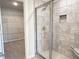 Modern bathroom features tiled shower with glass door and built-in shower niche at 511 Valentine Ct, Graham, NC 27253