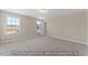 Bright bedroom featuring plush carpeting and large windows, creating a cozy and inviting space at 511 Valentine Ct, Graham, NC 27253