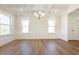 Bright dining room with coffered ceilings, paneled walls, hardwood floors, and ample natural light at 511 Valentine Ct, Graham, NC 27253