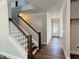 Foyer features a staircase with dark wood treads and white risers and banister at 511 Valentine Ct, Graham, NC 27253