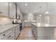 Spacious kitchen featuring granite countertops, stainless steel appliances, and gray cabinets at 511 Valentine Ct, Graham, NC 27253