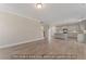 Spacious living room with an open floor plan and hardwood flooring leading to the kitchen at 511 Valentine Ct, Graham, NC 27253