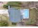 Backyard with an in-ground swimming pool, a spacious deck with furniture, surrounded by green grass and a gray roof at 512 Tryst Ln, Wake Forest, NC 27587