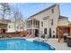 Backyard with in-ground pool and screened porch offers a great space for relaxing and entertaining at 512 Tryst Ln, Wake Forest, NC 27587