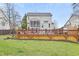 Home exterior showcases a large deck, in-ground pool, and spacious yard perfect for outdoor activities at 512 Tryst Ln, Wake Forest, NC 27587