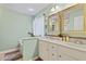 Bathroom featuring double sinks, stylish mirrors, and vanity with white cabinets at 512 Tryst Ln, Wake Forest, NC 27587