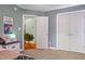 Bedroom with plush carpet, double closets, and view of the entry to another room at 512 Tryst Ln, Wake Forest, NC 27587