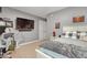 Spacious bedroom with a large bed, ceiling fan, closet, and an entertainment area at 512 Tryst Ln, Wake Forest, NC 27587