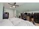 Comfortable bedroom with computer desk and a soft white comforter on the bed at 512 Tryst Ln, Wake Forest, NC 27587