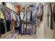 Walk-in closet with lots of storage racks and shelves for shoes and accessories at 512 Tryst Ln, Wake Forest, NC 27587