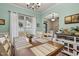 Bright dining room with large window, stylish decor, and wooden table set for dinner at 512 Tryst Ln, Wake Forest, NC 27587