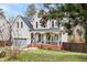 Charming two-story home with a welcoming front porch, garage, and beautifully landscaped front yard at 512 Tryst Ln, Wake Forest, NC 27587