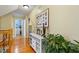 Upstairs hallway with wood floors and views to another room at 512 Tryst Ln, Wake Forest, NC 27587