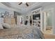 Comfortable main bedroom with a large bed, ceiling fan, walk-in closet, and en suite bathroom at 512 Tryst Ln, Wake Forest, NC 27587