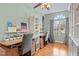 Home office with custom desks, built-in shelving, and large windows at 512 Tryst Ln, Wake Forest, NC 27587