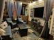 Comfortable outdoor patio with plush seating, fire table, and television perfect for cozy nights at 512 Tryst Ln, Wake Forest, NC 27587