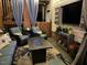Comfortable outdoor patio with plush seating, fire table, and television perfect for cozy nights at 512 Tryst Ln, Wake Forest, NC 27587