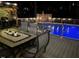 Outdoor patio with a barbeque and dining area adjacent to the refreshing in-ground pool at 512 Tryst Ln, Wake Forest, NC 27587