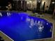 A glowing in-ground pool with an adjacent deck provides a relaxing outdoor escape at 512 Tryst Ln, Wake Forest, NC 27587